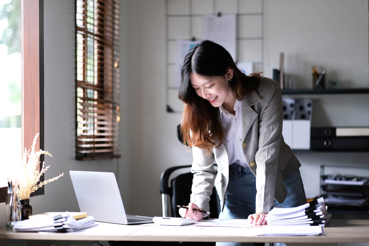 An employee that is happy for the satisfaction in her workplace.