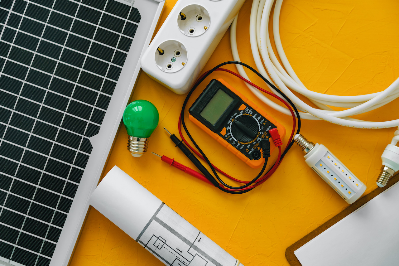 energy management system blueprint roll and solar panel that helps monitor, report and manage electricity.