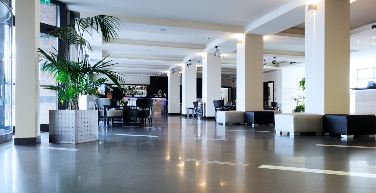 Modern illuminated decluttered lobby to welcome visitors.