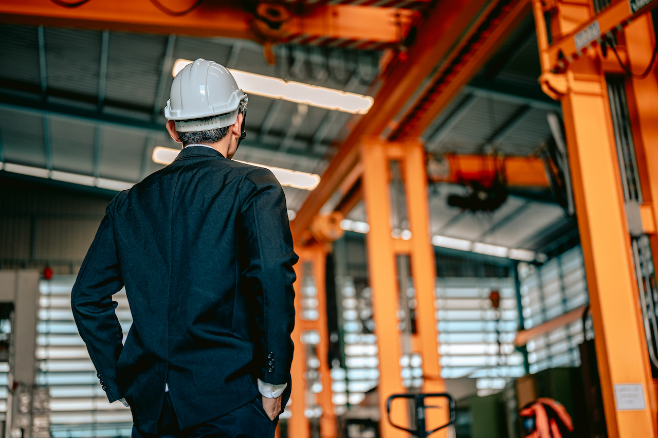 Manager engineer male close up in manufacturing factory.Industry,Architect and engineering concept.