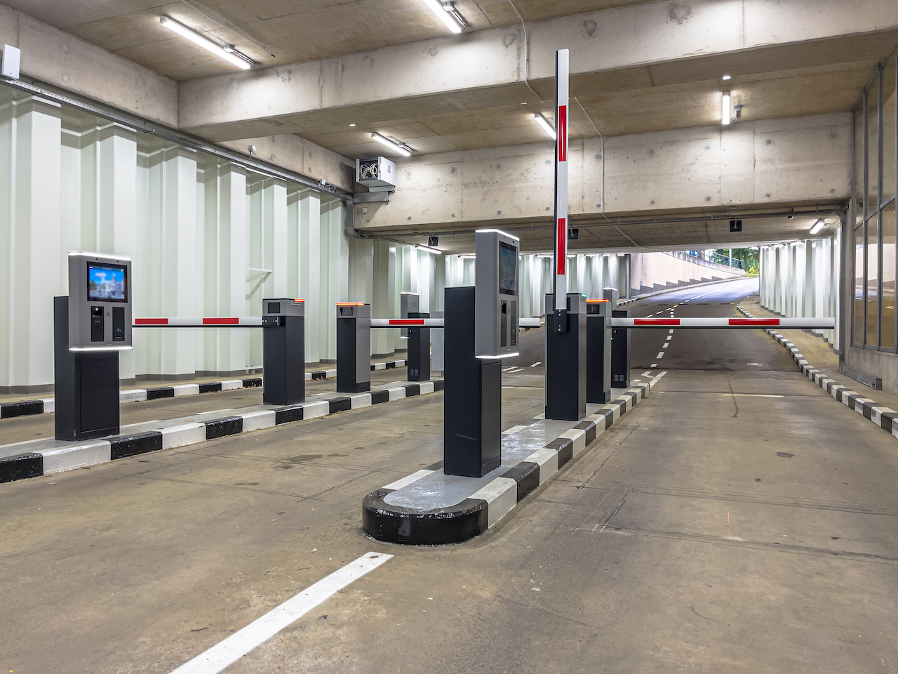 Barrier at Entrance and Exit of a car Parking garage. Fully automated barrier from car park. Underground parking, garage. Interior of parking