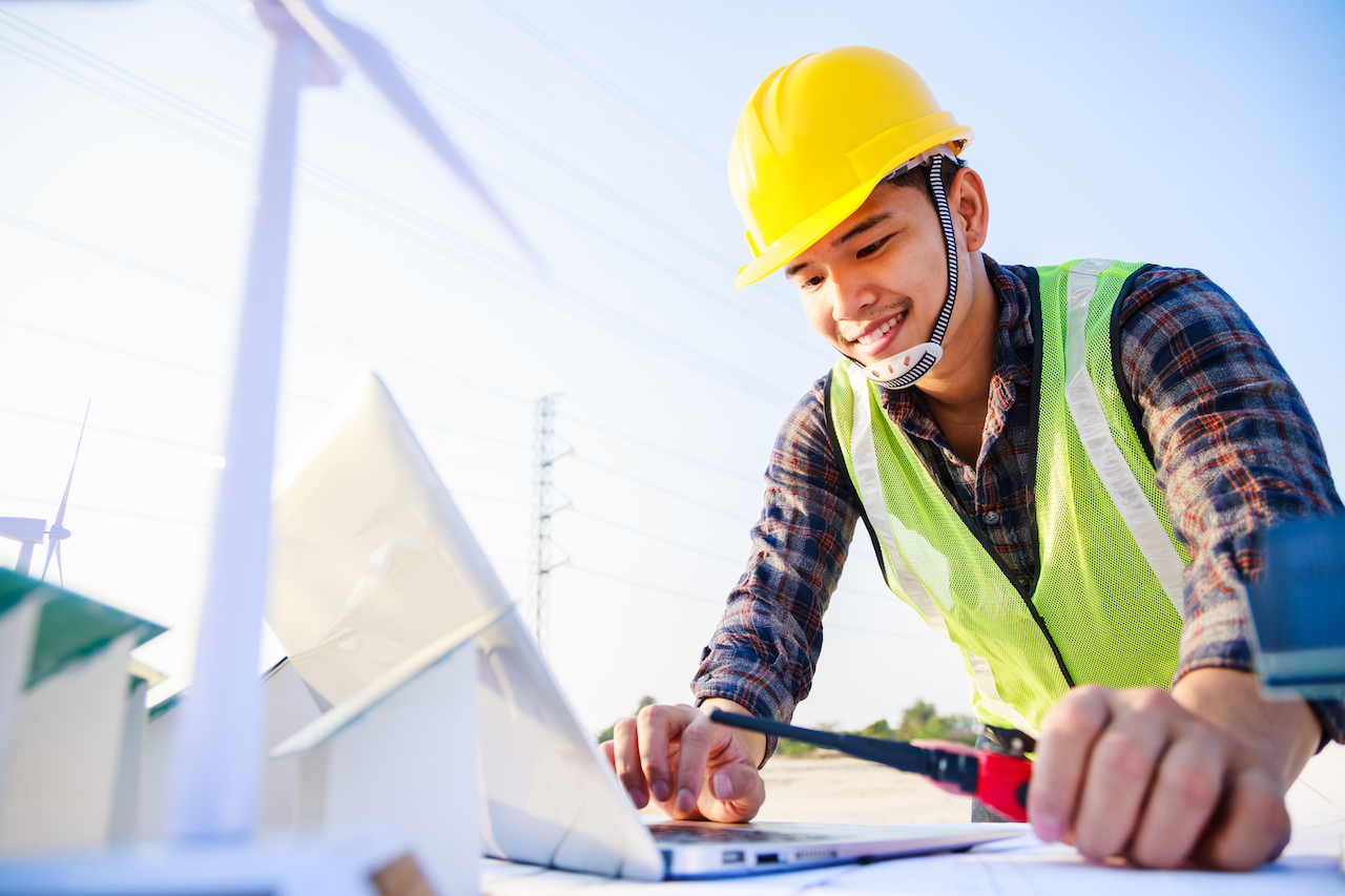 Smart engineer manager working by computer laptop at construction site project