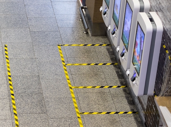 Wall mounted self-service visitor management kiosk.