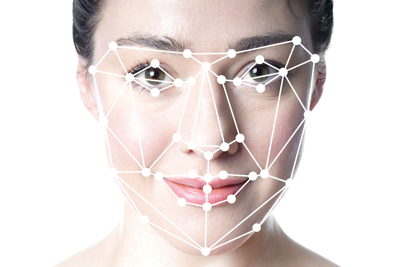 face detection or facial recognition grid overlay on face of young beautiful woman - artificial intelligence or identity or technology concept - A Guide To Facial Recognition - Applications Of Facial Recognition Technology