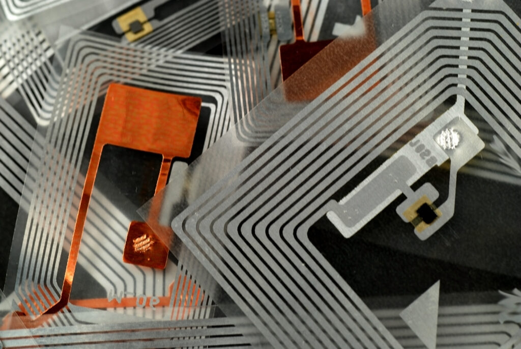 Assent Management use of RFID Radio frequency identification technology concept on device screen. Security and automation