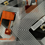 Assent Management use of RFID Radio frequency identification technology concept on device screen. Security and automation